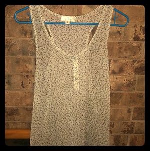 Sheer blouse with a pretty floral design.